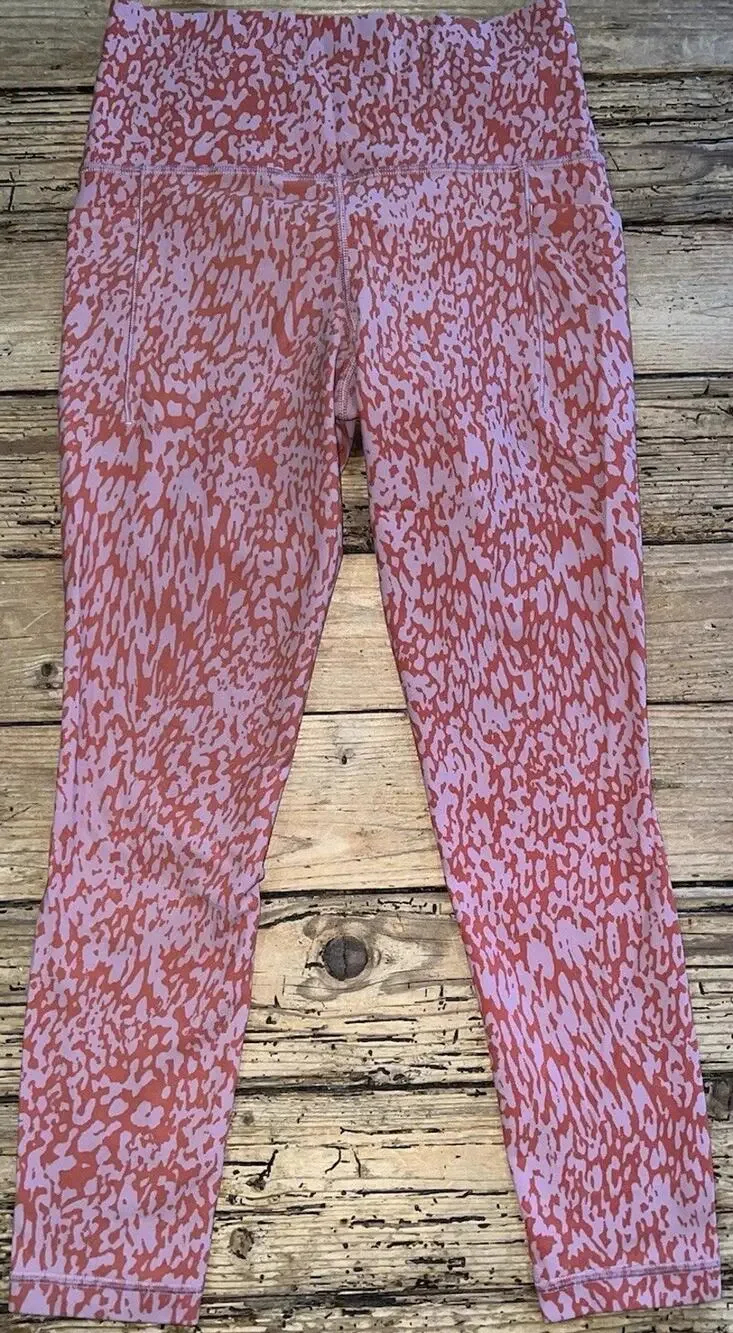 Athleta Salutation Stash Pocket II Printed 7/8 Tights Ocelot Spot Orange size S